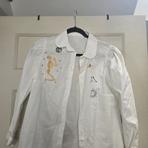 Artistic White Shirt with Skeleton and Sun Designs